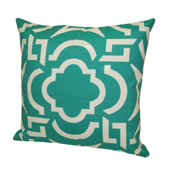 Indoor/outdoor pillow by Rennie & Rose on a patio, poolside, or porch, adding comfort and vibrant style to outdoor spaces