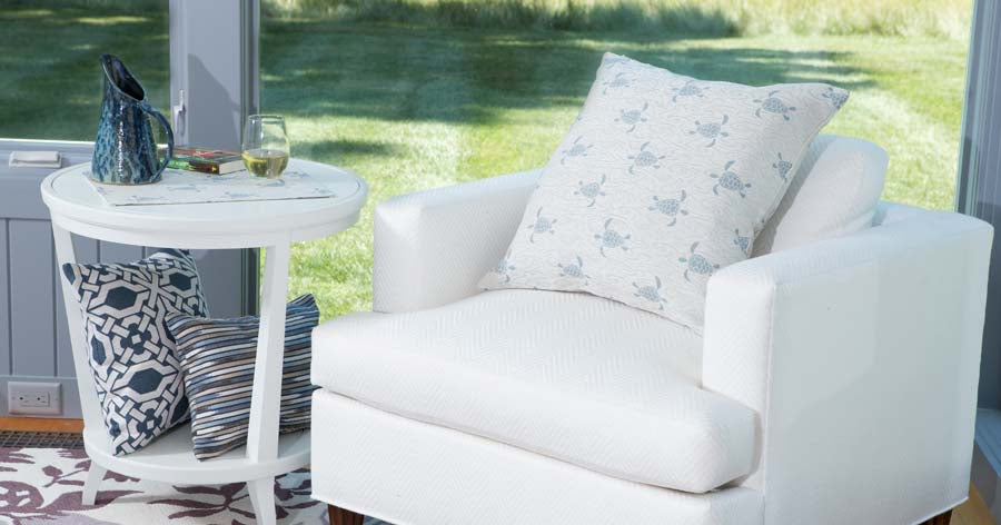 Coastal-themed pillow with ocean-inspired colors and patterns, perfect for indoor or outdoor décor