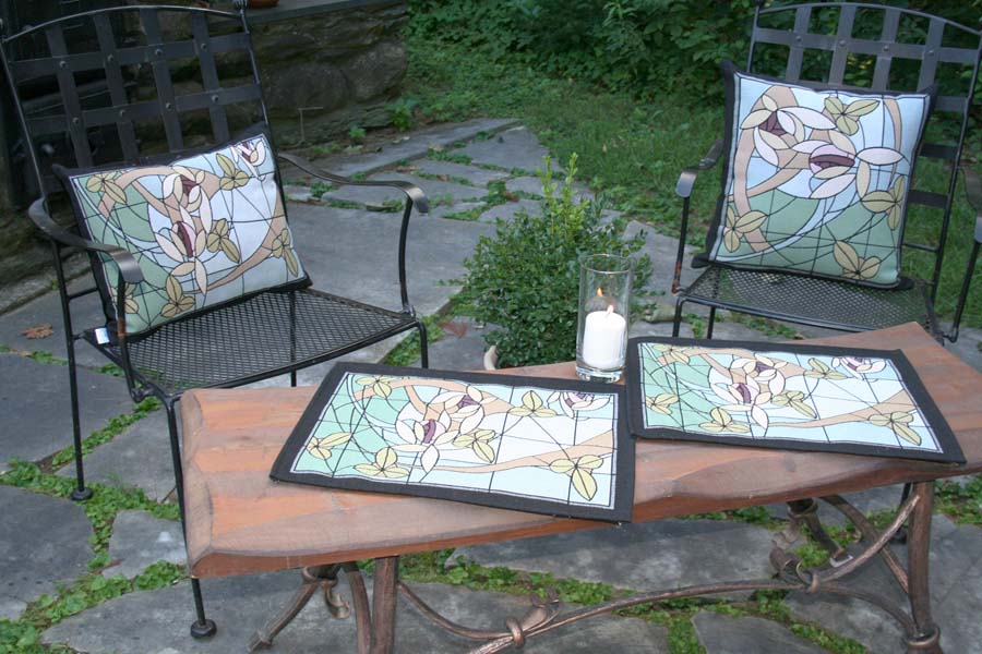 Inspired by the beauty of stained glass, our Flowers & Vines Crystal placemats and pillows features soft pastel tones and intricate woven detail. Artisan-crafted in the USA — a timeless accent for dining or décor.