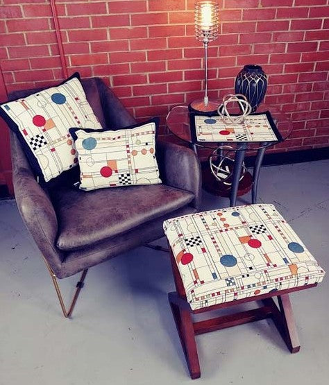 Circle Study Pillows, placemat and foot stool covered in our all over fabric