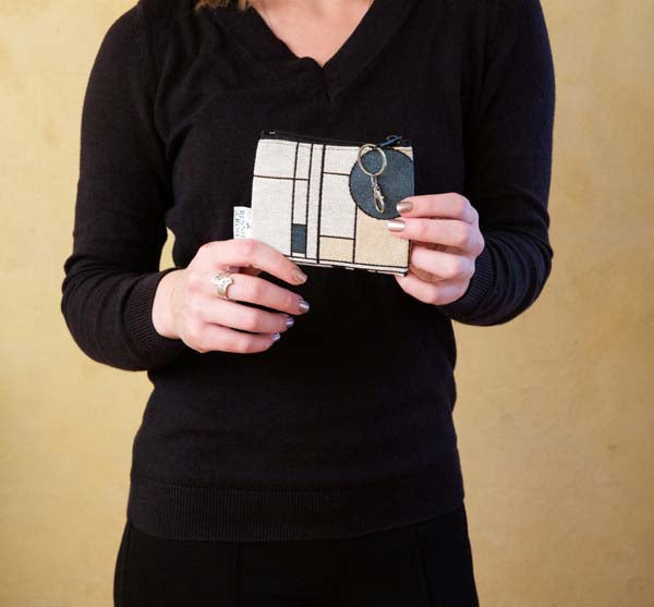 Jacquard woven coin and card case with Circle Study pattern and key ring clasp.